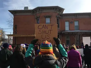 Marchers protesting gender inequality, President Donald Trump and other issues gathered on Syracuse's North Side on Saturday morning. 