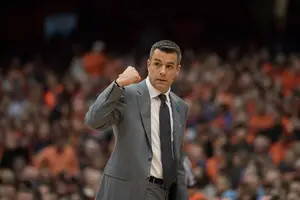 Tony Bennett, pictured against Syracuse last season, has built a winning culture at Virginia behind his five pillars and packline defense.