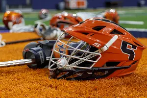 Syracuse men's lacrosse has worn the helmets above for years. The women will wear slightly different helmets this year, the first year in them.