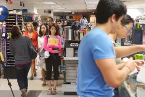 SU students wait in line to purchase textbooks and school supplies at the Schine Student Center. 