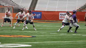 Tehoka Nanticoke, pictured at the right of the frame, scored five goals in leading Albany to a blowout victory.