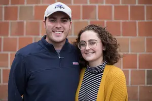 Erin Elliott (right), a Syracuse University sophomore, has continued pursuing her education despite battling thyroid cancer. She and John Fisher (left), who works with Hill Communications and PRSSA, hope to help college students feel more comfortable discussing the disease.