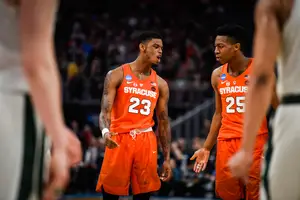 Tyus Battle and Frank Howard pictured against Michigan State. The Orange upset the Spartans 55-53 in the Round of 32 and two of our three beat writers expect the Orange to move on again.