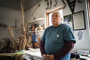 Alfie Jacques crafts wooden lacrosse sticks in a barn on the Onondaga Nation reservation.