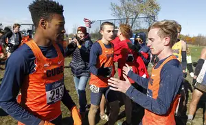 Justyn Knight (left) will graduate this spring, leaving SU track and cross country in the hands of Aidan Tooker (right).