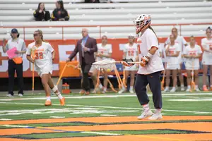 Asa Goldstock walks the ball up against Florida on March 7. The sophomore, who has excelled in the net this season, has contributed in jumpstarting the SU offense this year, too.