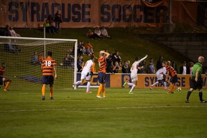 Syracuse players watch as Clemson celebrates a goal in a 2017 match. 