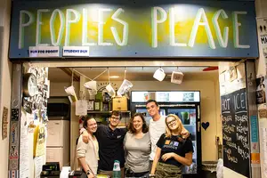 Sarah Butts, Charles Burg, Hayley Bermel, Daniel Higgins and Lindsey Dierig (left to right) are staff members working at People's Place during a morning rush.