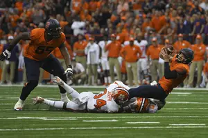 Eric Dungey stretches for a first down in SU's upset win last season.
