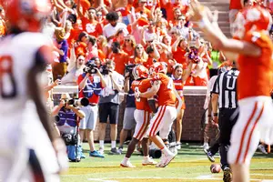 Travis Etienne celebrates one of his two fourth quarter touchdowns that helped Clemson come back from a 10-point deficit.
