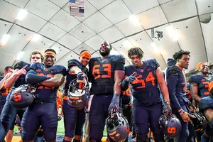 Syracuse players celebrate after beating NC State on Saturday night in the Carrier Dome. 