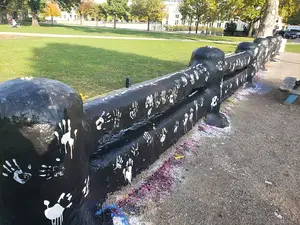 Sitting in the middle of Carnegie Mellon University's campus lies a concrete fence that used to divide the school before it became coed. Today, it is a university tradition to paint the fence for important occasions or messages.
