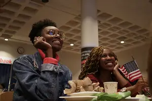 SU students Bria Huff (left) and Jordan Hubbard watch election results roll in at a Schine Student Center watch party on Tuesday night. 
