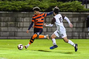 Tajon Buchanan kicks the ball against St. Bonaventure. He arrived at SU with the help of an unconventional path.