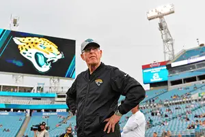 Tom Coughlin surveys the field before a Jaguars game. Long before he stepped into the Jags’ front office, he was a young coach at Syracuse.

