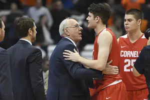 After last November’s game, Jim and Jimmy Boeheim convene at midcourt to exchange a few words. “You were close to having a good game,” Jim told his son. 
