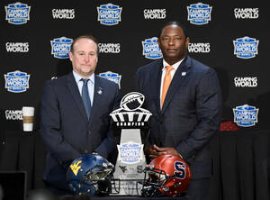 Dino Babers poses with the Camping World Bowl 2018 trophy ahead of Syracuse's matchup with West Virginia Friday.