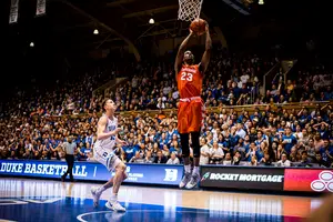 Frank Howard glides to the rim for a layup in overtime to push the Orange's lead to four points. Syracuse finished off the monumental upset in a 95-91 win over Duke.