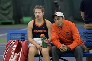Sofya Golubovskaya and Younes Limam chat during a changeover.