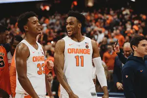 Elijah Hughes and Oshae Brissett celebrate after defeating Georgetown in Syracuse's nonconference slate.