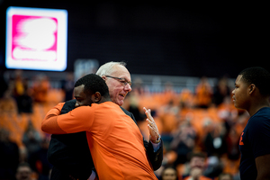 Syracuse walk-on Adrian Autry hugs SU head coach Jim Boeheim on Senior Night.