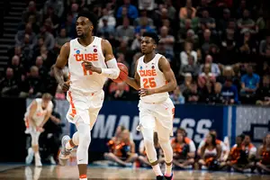 Tyus Battle and Oshae Brissett run up the floor in Syracuse's NCAA Tournament matchup with Baylor.