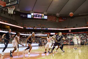 Syracuse chases for a loose ball in its regular-season matchup with Notre Dame.