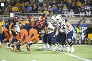 Kendall Coleman, pictured against Virginia in the Camping World Bowl, rushing the quarterback. 