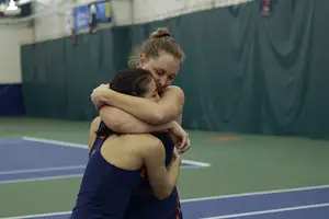 Gabriela Knutson and Miranda Ramirez embrace after winning a match. 