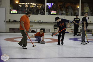 Curlers prepare to bowl at the National College Curling Championship. 