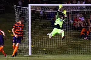 Hendrik Hilpert, SU's goalie from 2015-18, makes a save in last year's game vs. Notre Dame.