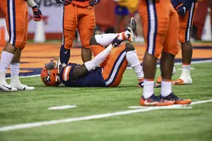 Trill Williams lies on the field with an injured left leg. The Orange lost multiple defensive players due to injury in Friday night's loss to Pittsburgh. 