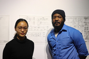Parinda Pin Sangkaeo (left) and Benson Joseph (right) worked together to curate an exhibit titled “The Living Room Conversation: In Memory of Professor Kermit J. Lee Jr.”