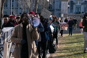 Protesters chanted and carried signs as the march snaked across SU’s campus.