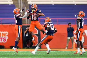 Robert Hanna celebrates with teammates during Syracuse's home opener against Georgia Tech.