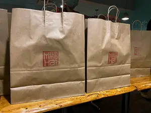 Customers can purchase takeout food from Salt City Market’s vendors on “Takeout Fridays.” The weekly dinner service is meant to create relationships with customers before the market opens in January.
