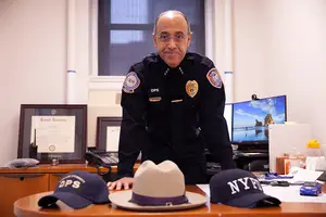 Chief Bobby Maldonado’s office in Sims Hall holds a collection of hats from his years working in law enforcement and growing up in New York.
