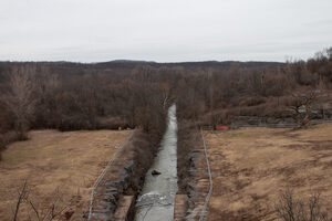 Tully Valley land transfer is one of 18 restoration projects NYS ordered Honeywell Inc. to complete after over a century of chemical dumping. Onondaga Creek, sacred water to the Haudenosaunee and a main tributary of Onondaga Lake, runs through land returned via the agreement in the Tully Valley.