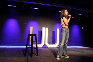 Senior Julia Dicesare takes the stage at Schine Underground during Saturday night’s comedy show ‘College Chuckle.’ The show on Saturday night marked the first student-comedy show put on by University Union. 