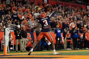Defensive back Isaiah Johnson attempts to disrupt a pass during Syracuse's 35-31 win over Wake Forest Saturday. 