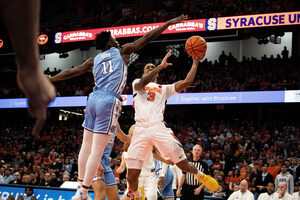 After falling to the Tar Heels on Jan. 13, our beat writers are split if Syracuse will defeat No. 7 North Carolina Tuesday.