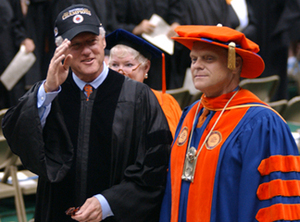 President Clinton walks with Chancellor Shaw to the stage where Clinton addressed the 2003 SU graduating class.