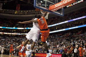 Dion Waiters gets fouled by Villanova's James Bell near the end of SU's 69-64 win Monday.