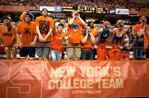 Students cheer on New Yorks College Team during the football game against Rutgers University on Saturday. Athletic Director Daryl Gross said SU would continue to use the NYC appeal for marketing.