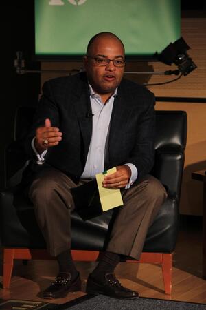 Mike Tirico, ESPN broadcaster, speaks in the Hergenhan Auditorium on Wednesday as part of a four-hour event. The panels included a telephone call with Donovan McNabb, a Minnesota Vikings player.