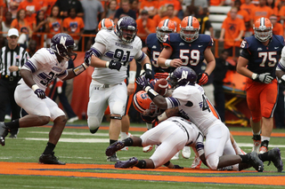 Syracuse tight end Beckett Wales fumbles the ball as he is hit in the first half.