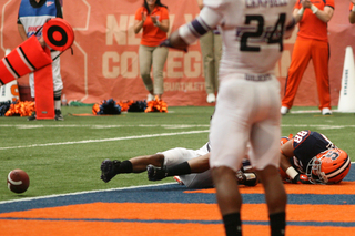 Syracuse wide receiver Jarrod West lays in the end zone after an incomplete pass.