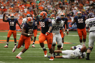 Syracuse defensive tackle Jay Bromley (96) reacts after sacking Northwestern quarterback Kain Colter.