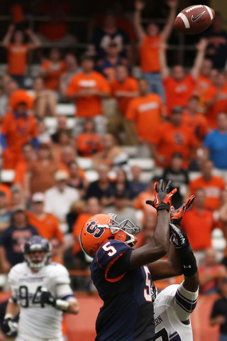 Syracuse wide receiver Marcus Sales fights for the ball in the second half.