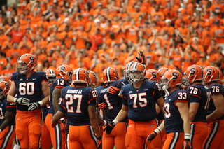 Syracuse players gather together before the game.